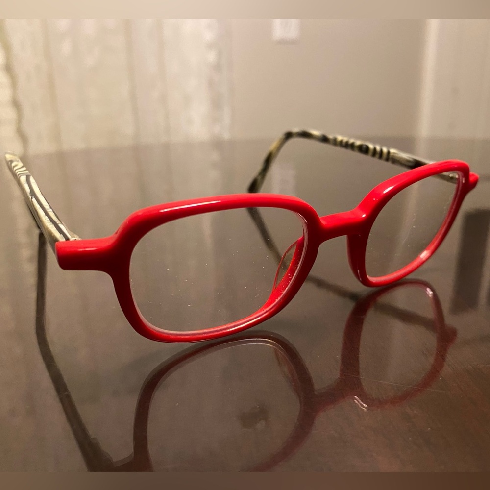 Eyebobs “been there” frames. Bright red with black and white zebra temples.